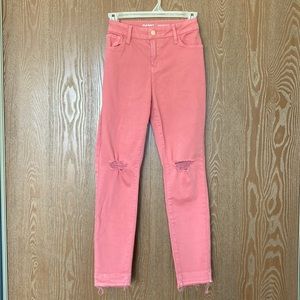 Light pink/coral straight-legged jeans with knee-holes and distressed bottoms